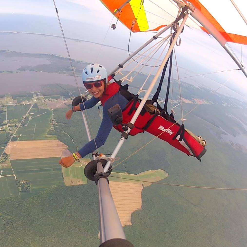 Sara Weaver flying a hang glider over the Currituck Sound