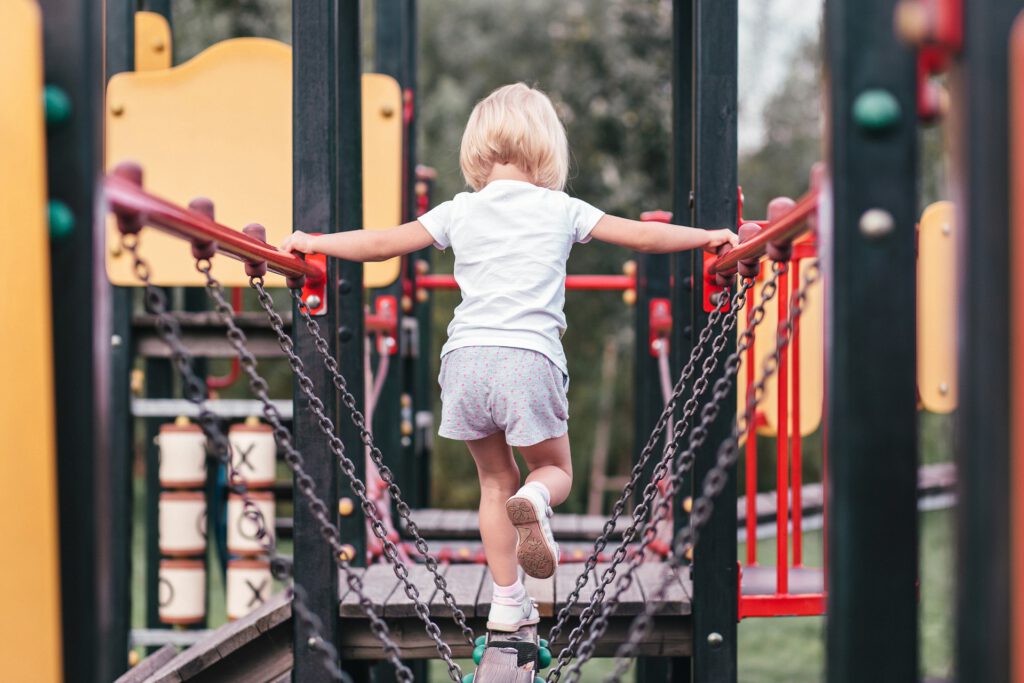 Girl playing on park playground