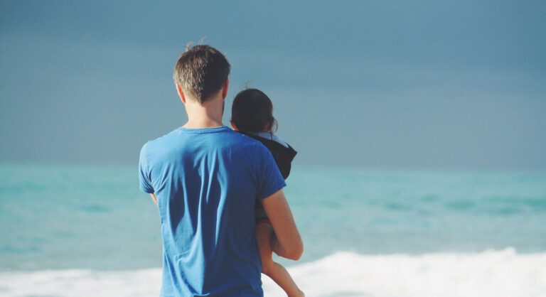 Father and child at the beach