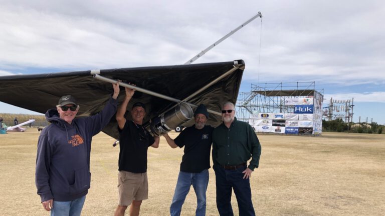 Brewtag team in front of flight deck tower